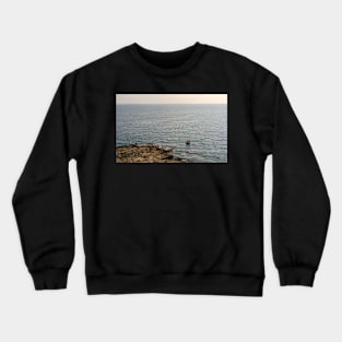 Lonely boat floating on the Mediterranean sea Crewneck Sweatshirt